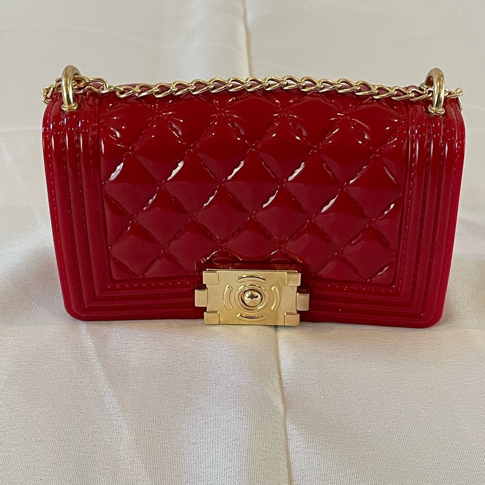 Small red jellybean clutch with gold hardware